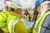 A group of workmen looking at some plans